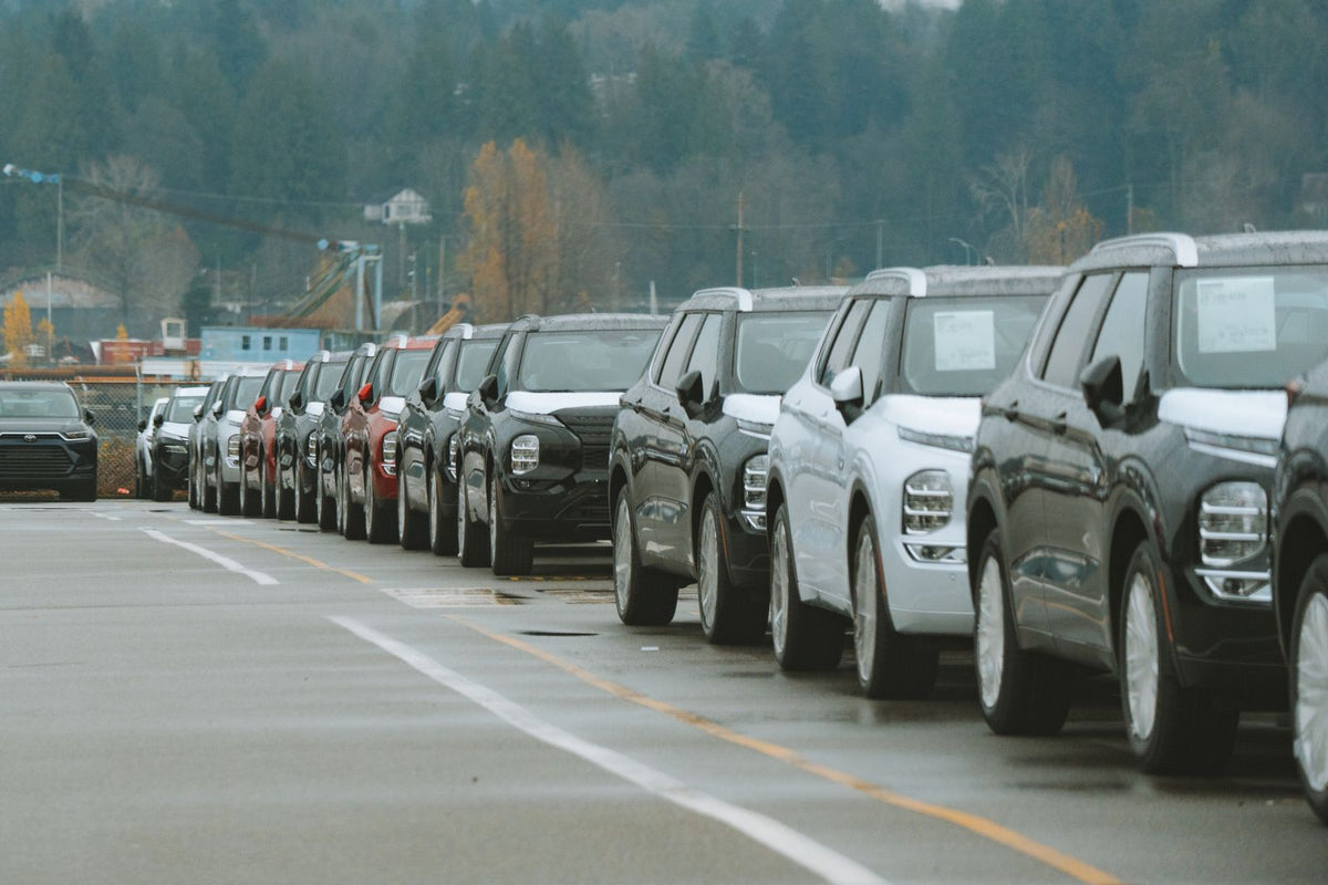 Rows of new SUVs parked in a dealership lot